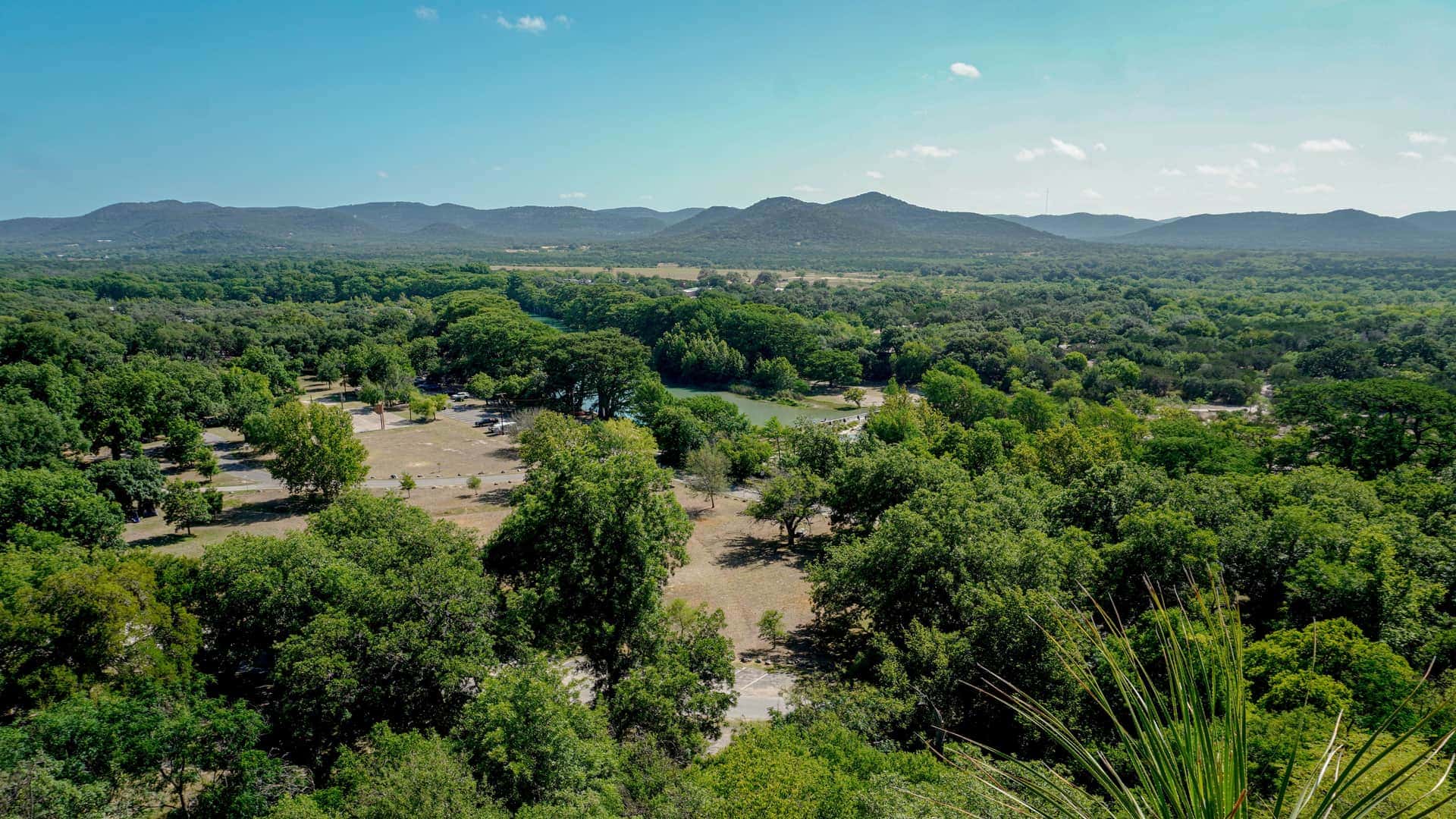 Texas hill country: rolling limestone hills and live oaks above a river valley